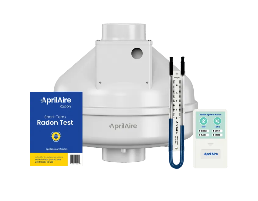 AprilAire radon mitigation kit featuring a fan, short-term test packet, U-tube manometer, and digital system alarm.