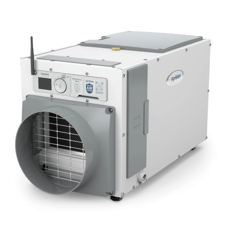 White AprilAire dehumidifier unit with a digital display, antenna, and large grey air duct on a white background.